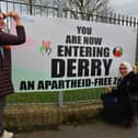 Nadya Tannous, left, Yasmine El Souda and Nihal El Ansar representing  the Palestine Youth Movement launch a sign “You are now entering Derry an apartheid free zone” erected by the Bloody Sunday Trust, at the Junction of Letterkenny Road and Lone Moor Road, as part of this year’s Bloody Sunday anniversary events. Photo: George Sweeney