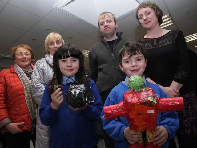 Two of the younger artists displaying their work at the exhibition in Eden Place Arts Centre, Pilot's Row on Wednesday night, Finola and Art Dobbins. At back from left are Mary O'Boyle, Anne Griffin, Alan O'Kane and Judi Logue, Facilitator. DER5114MC054