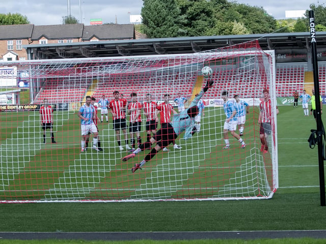 GREAT SAVE!. . .Tristar's goalkeeper Cayden McGarrigle gets fingertips to this Phoenix free kick only for the parried ball to be headed home by Phoenix Oran Sweeney on Saturday. (Photos: Jim McCafferty Photography)