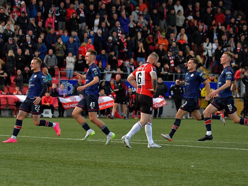 August 2023: St Patrick’s Athletic players rush past a dejected Mark Connolly after keeper Dean Lyness saved his penalty, in the FAI Cup game at the Brandywell . Photo: George Sweeney.