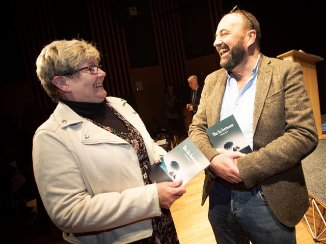 Hollybush PS Acting Principal and poet/author Feargal Friel shares a joke with his Board of Governors chair Angela Dobbins at Thursday night's book launch.
