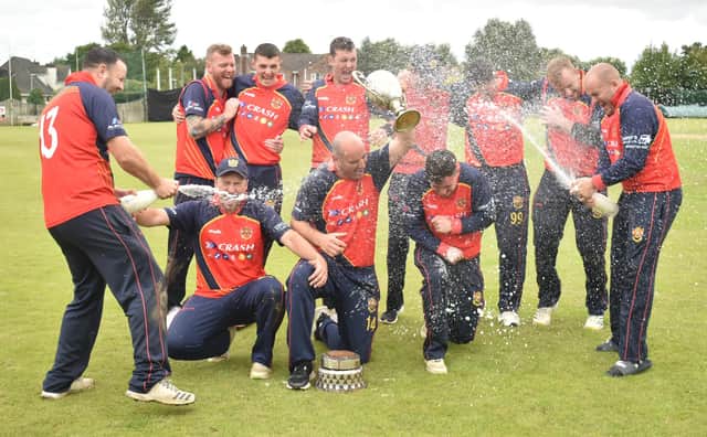 The champagne is flowing as Brigade celebrate their Sports Hub Senior Cup success against Newbuildings. (Photo: Lawrence Moore)