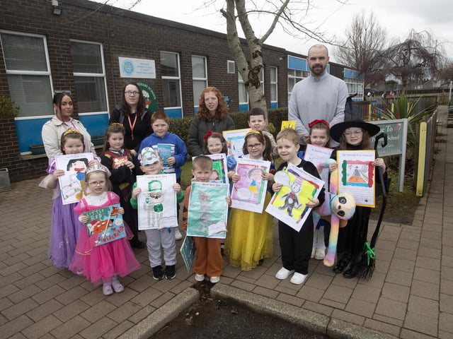 Mr. Kevin Smith and Classroom Assistants pictured at Greenhaw Primary School on Friday with Key Stage 1 World Book Day prizewinners.