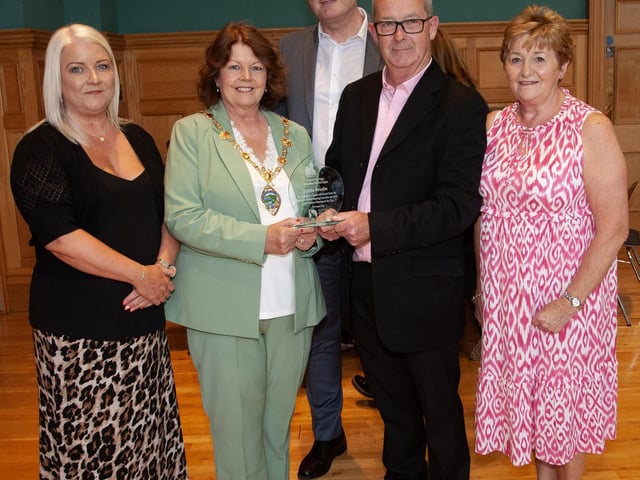 The Mayor Patricia Logue pictured with Eddie Breslin and some of his former colleagues from the Housing Executive at a function in his honour at the Guildhall on Thursday evening.