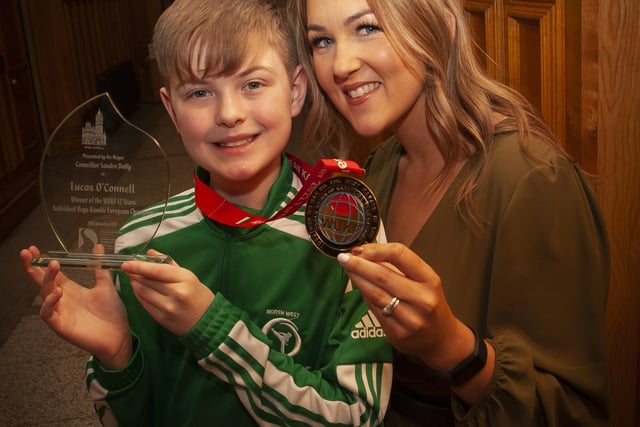 PROUD MUM!. . . .Lucas proudly pictured with his mum Kerry, European medal and the presentation he received from the Mayor of Derry City and Strabane District Council, Sandra Duffy on Tuesday evening.