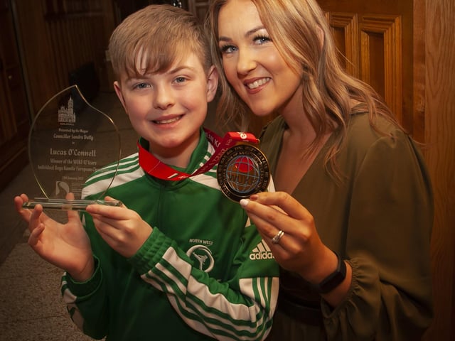 PROUD MUM!. . . .Lucas proudly pictured with his mum Kerry, European medal and the presentation he received from the Mayor of Derry City and Strabane District Council, Sandra Duffy on Tuesday evening.