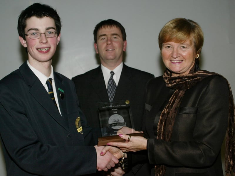 Lorcan Doherty who achieved 1st place in NI in his GCSE music exams pictured here receiving his award from Marian Machett, Chief INspector DENI.  Included in photo is Mr Stephen Gallagher, Head of Key Stage 4.  (1001JB30)