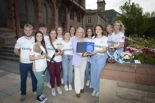 ALL-IRELAND WINNERS. . . . . .The Mayor, Sandra Duffy makes a presentation to Mairead Comer, Vice Captain/Goalkeeper, University of Ulster at Magee College Camogie team, to mark the occasion of their winning the inaugural Ashling Murphy All-Ireland Camogie Championship, during a reception in their honour at the Guildhall on Tuesday evening. Included are team members and coaches. (Photos: Jim McCafferty Photography)