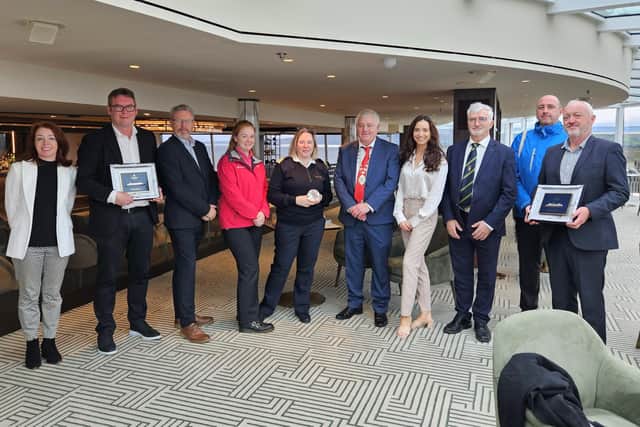 Plaque Exchange onboard Explora I on August 31, 2023. From left to right: Lisa McLaughlin, Trade Liaison Manager, Go Visit Inishowen; Leo McParland, Managing Director, Hamilton Shipping; Matt Doherty, Business Development Officer, Visit Derry; Catherine Crawley, Visitor Services Officer, Visit Derry; Captain Serena Melani, Explora Journeys; Martin Harley, Cathaoirleach, Donegal County Council; Louise Denvir, Cruise Marketing Executive, Foyle Port; John McLaughlin, Chief Executive, Donegal County Council; David Leonard, Wild Atlantic Way Officer, Fáilte Ireland; Harbour Master Captain Bill McCann, Foyle Port