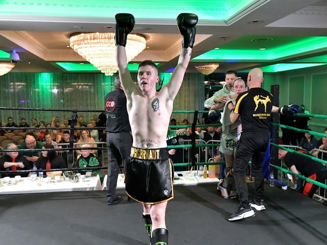 Rathmor Warrior’s Conal McBrearty celebrates his defeat of CJ Silcock, Fightclub NI, to win the All Ireland 66kg K1 Title, on Saturday evening last, in the Everglades Hotel. Photo: George Sweeney. DER2312GS – 79