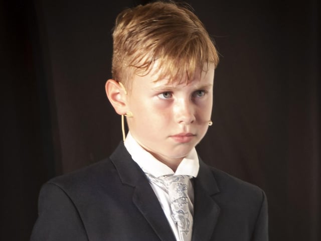 A stern Captain Vonn Trapp making his disapproval of Maria known.