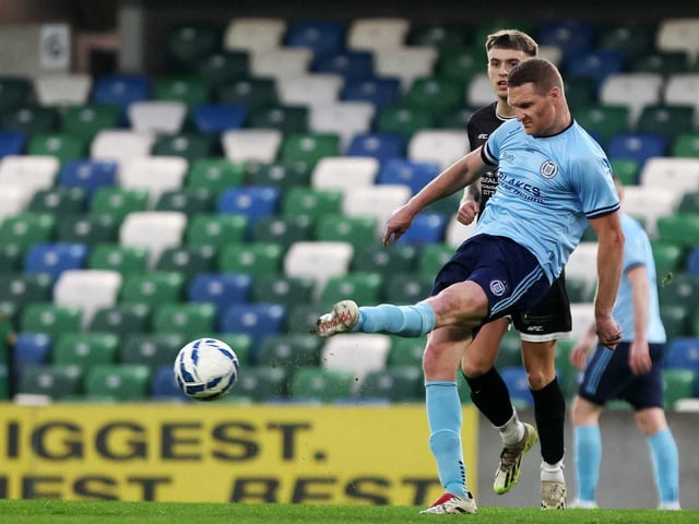 Enniskillen Town United captain Cathal Beacom clears with Jack Coyle looking on during Friday's fonaCAB Craig Stanfield Irish Junior Cup final at Windsor Park. (Photo: IFA)