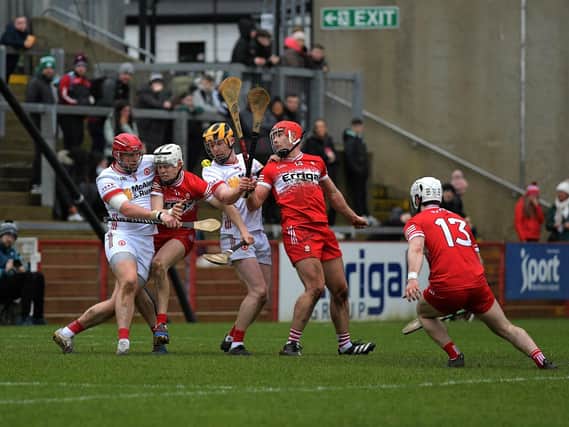 Tyrone and Derry players contest a loose sliothar during the league meeting between the counties. Photo: George Sweeney