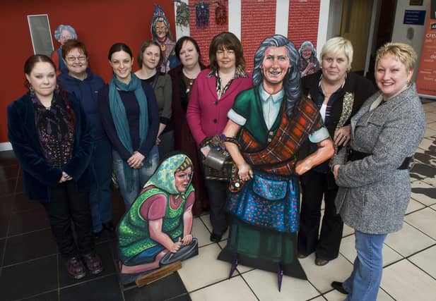 Councillor Patricia Logue, third from right, representing the Mayor, pictured with members of the Eden Place Arts Centre at the exhibition of their work "Women's Real Lives" part of International Women's Day in The Verbal Arts Centre on Friday. Included are, from left, Aine Croston, Judy Logue, Claire McDermott, Beryl Stewart, Andrea Redmond, Susan Gill and Sharon Daly. LS11-162KM