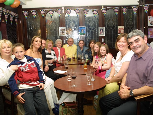 Alana surrounded by her friends and family during her birthday party