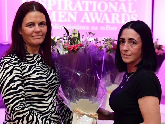 Fionnuala McNulty receiving her presentation from Aine Doherty in memory of her mother, Sadie Callan.