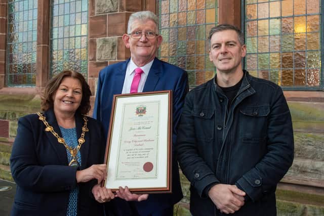 Derry City and Strabane District Council Mayor, Councillor Patricia Logue and Councillor Shaun Harkin , who proposed the motion, with Jon McCourt who has been awarded the freedom of Derry City and Strabane following a ceremony in The Guildhall. Jon has campaigned tirelessly for the victims of Institutional abuse. Picture Martin McKeown. 19.12.23