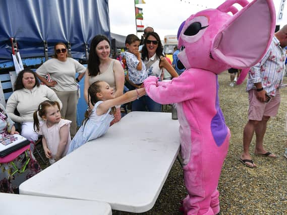 Children meet Angel at the Family Fun Day at Fahan Marina on Sunday afternoon. Photo: George Sweeney