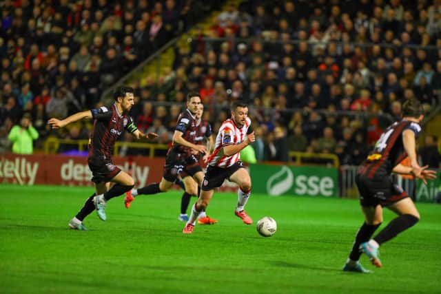 Michael Duffy races past Jordan Flores during Derry City's FAI Cup semi-final clash with Bohemians at Dalymount. Photograph by Kevin Moore.
