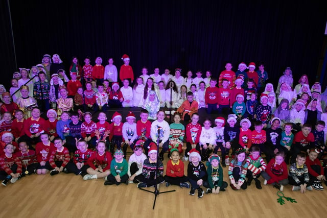 The pupils from Primary 3 and 4, pictured before performing 'Little Angel gets her wings' at last week's Christmas celebrations in the school. (Photos: Jim McCafferty Photography)