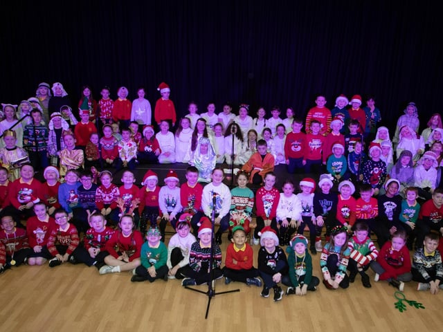 The pupils from Primary 3 and 4, pictured before performing 'Little Angel gets her wings' at last week's Christmas celebrations in the school. (Photos: Jim McCafferty Photography)
