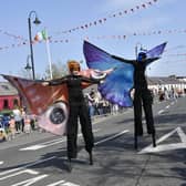 These stilt walkers entertained the crowd as they waited to watch the Easter Parade in Carndonagh in 2019 DER1719-161KM