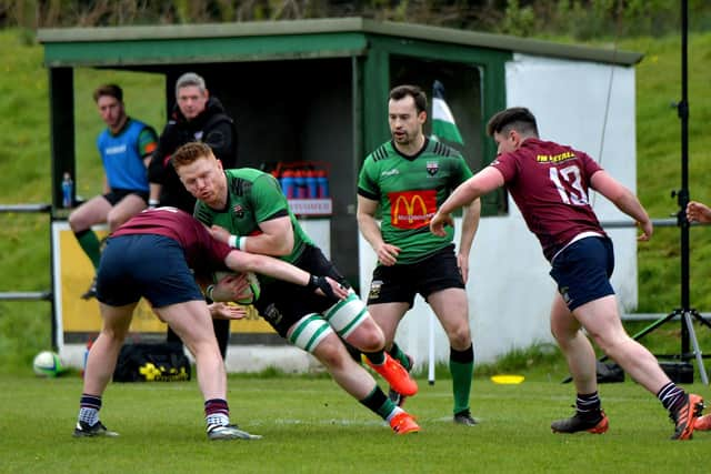 City of Derry ‘s Stephen Corr battles to keep possession against Enniskillen.  Photo: George Sweeney.  DER2316GS – 55