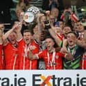 Derry City captain Patrick McEleney raises the FAI Cup following the Candystripes' 4-0 victory over Shelbourne in 2022. (Photo: Kevin Moore/MCI)