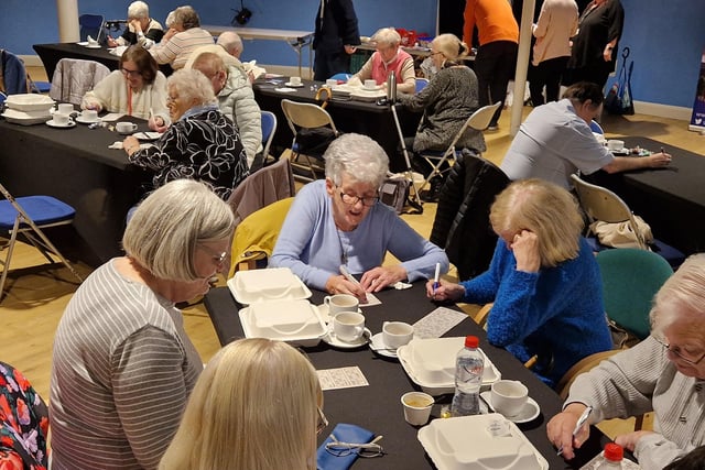 Attendees enjoy a game of bingo at the event to mark International Older People’s Day