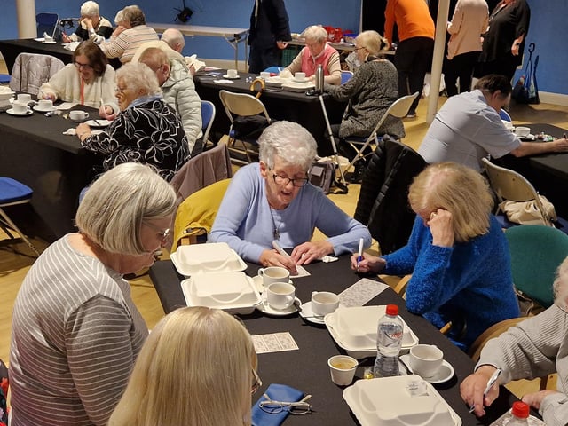 Attendees enjoy a game of bingo at the event to mark International Older People’s Day
