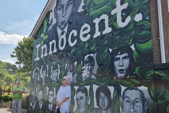 Eileen Webster singing Bloody Sunday at the new mural on Thursday.