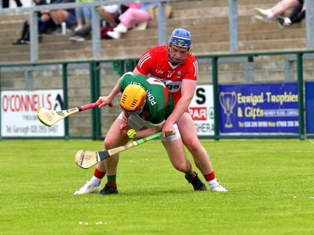 Derry's Sean Kelly battles with Mayo's Conor Murray during the Christy Ring Cup game in Owenbeg. (Photo: George Sweeney}