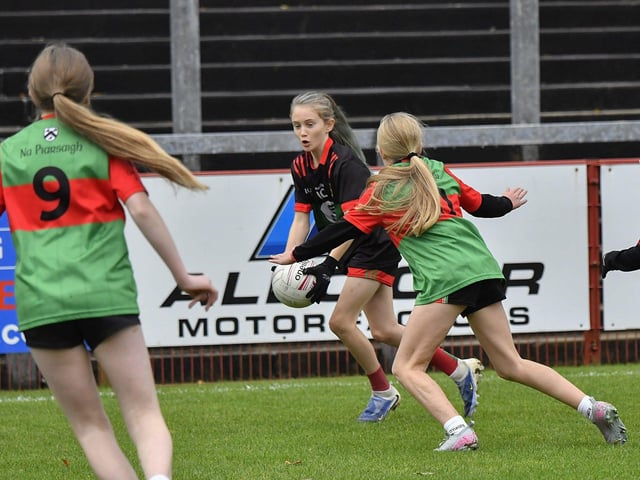 Young footballers from Doire Trasna and Slaughtmanus Under 12 teams play at half-time at the Derry Junior Football Championship Final held in Celtic Park on Sunday afternoon. Photo: George Sweeney