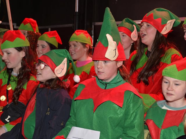 Pupils from Thornhill College sing Christmas carols at the Culmore Community Hub on Friday night. Photo: George Sweeney