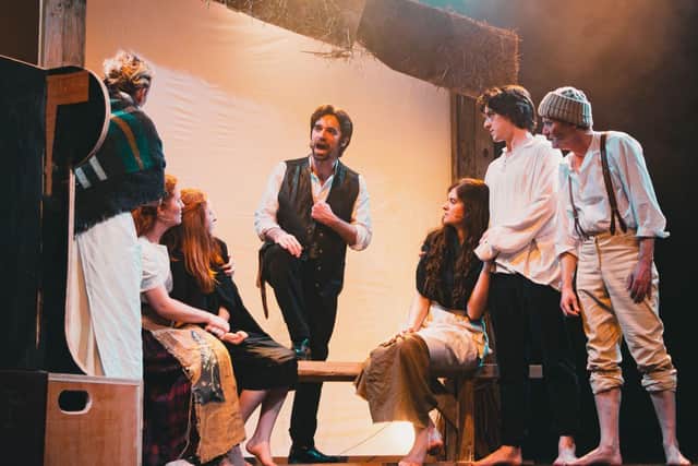 Conor O'Kane and fellow actors on stage in the musical In The Midst of Plenty.