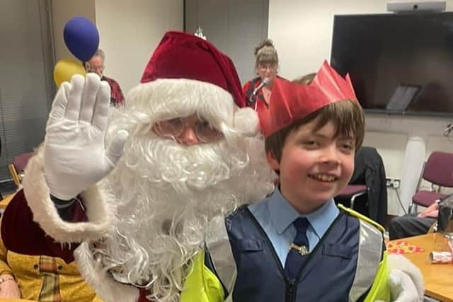 Little Blue Hero Ray Campbell meets Santa Claus.