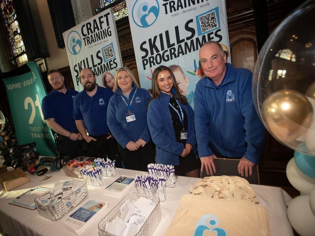 Staff at the Craft Training stall during Thursday's Apprenticeship Fair in the Guildhall, Derry.