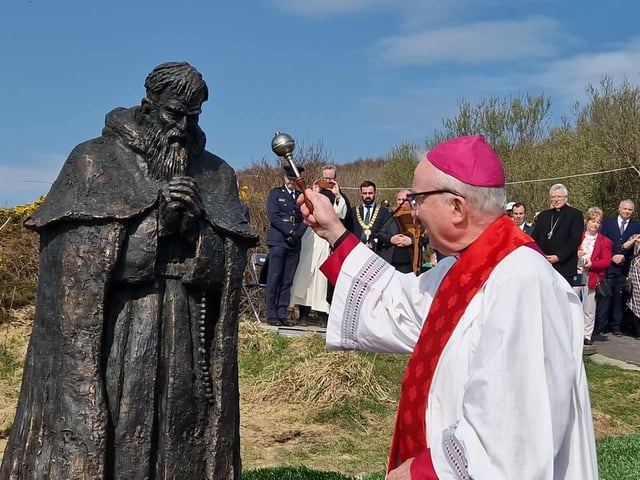 The statue is blessed by Bishop McKeown.
