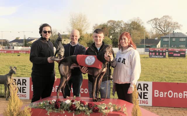Spencer Saberton (left), Lifford Racing Manager, presents William Mullan with a trophy in recognition of his achievement in training 1,000 winners. Beside Mr Mullan is his nephew, Tom Mullan, and Janine Barber. (Photo by John Killen)
