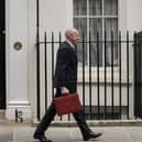 Britain's Chancellor of the Exchequer John Healey leaves 11 Downing Street with the Budget Box. (Photo by CARLOS JASSO / AFP via Getty Images)
