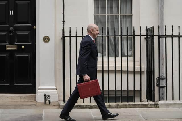 Britain's Chancellor of the Exchequer John Healey leaves 11 Downing Street with the Budget Box. (Photo by CARLOS JASSO / AFP via Getty Images)