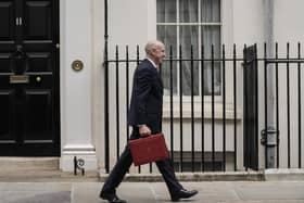 Britain's Chancellor of the Exchequer John Healey leaves 11 Downing Street with the Budget Box. (Photo by CARLOS JASSO / AFP via Getty Images)