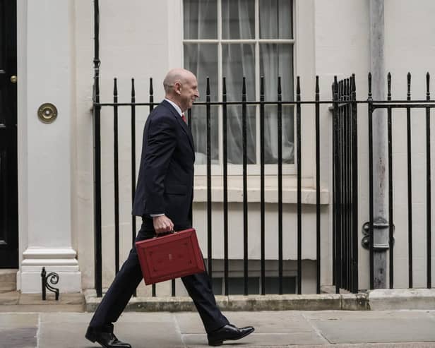 Britain's Chancellor of the Exchequer John Healey leaves 11 Downing Street with the Budget Box. (Photo by CARLOS JASSO / AFP via Getty Images)