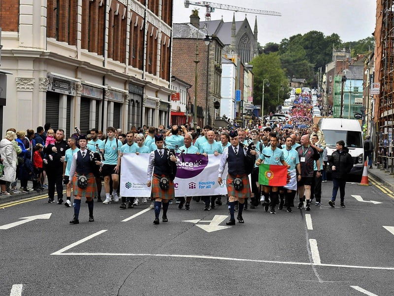 The Foyle Cup teams parade down Great James Street towards the Guildhall Square. Photo: George Sweeney