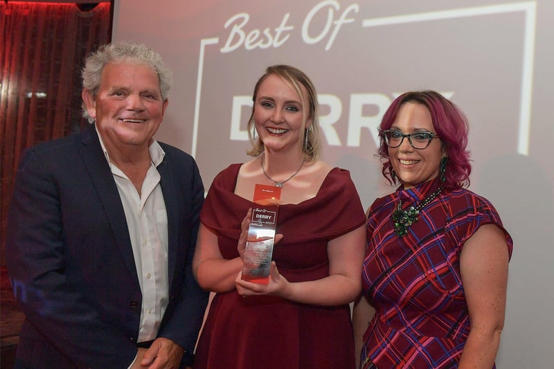 Business Person of the Year Award winner Charlene McCrossan, City Walking Tours, receives her trophy from Karina McKinney, Calor Custer Service Advisor, on the right, and compere Adrian Logan.  Photo: George Sweeney. DER2325GS – 51