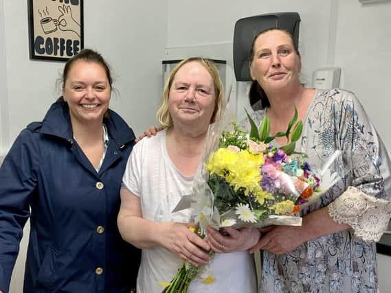 Kathleen Tracey (centre) was presented with a bouquet of flowers by Lisa McLaughlin (left) at the big Gala Night of Racing. Kathleen’s friend is on right of photo.