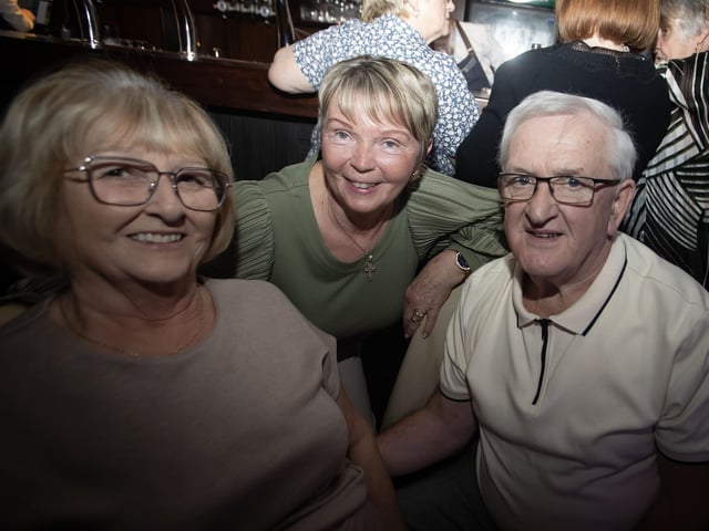 Liz and Martin Gallagher and centre, Catherine Hannaway pose for a photo on Tuesday night.