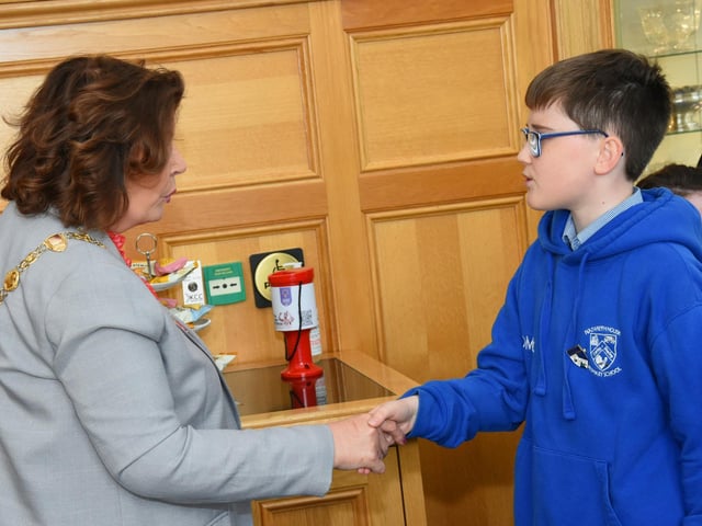 Nazareth House Primary School pupil Odhran meeting the Mayor Patricia Logue in the Mayor's Parlour on Wednesday morning when the School Council visited the Guildhall.