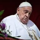 Pope Francis at the main balcony of St. Peter's basilica for the Urbi et Orbi message and blessing to the city and the world as part of Easter celebrations, at St Peter's square in the Vatican on April 20, 2025. (Photo by Tiziana FABI / AFP) (Photo by TIZIANA FABI/AFP via Getty Images)