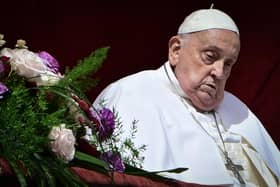 Pope Francis at the main balcony of St. Peter's basilica for the Urbi et Orbi message and blessing to the city and the world as part of Easter celebrations, at St Peter's square in the Vatican on April 20, 2025. (Photo by Tiziana FABI / AFP) (Photo by TIZIANA FABI/AFP via Getty Images)
